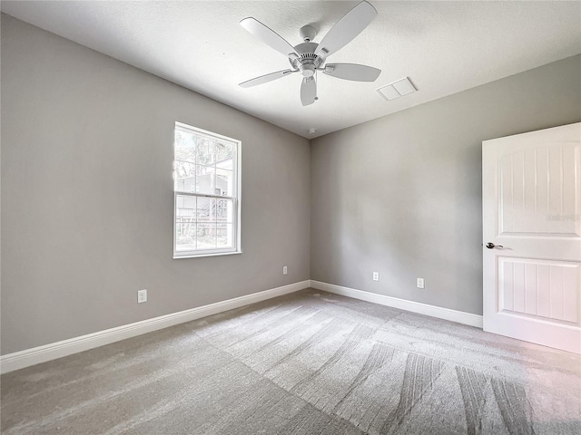 509 Mulberry St, Fruitland Park, FL 34731 - empty room featuring baseboards, a textured ceiling, carpet floors, and a ceiling fan