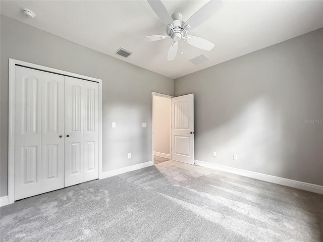 509 Mulberry St, Fruitland Park, FL 34731 - unfurnished bedroom featuring a closet, baseboards, carpet flooring, and visible vents