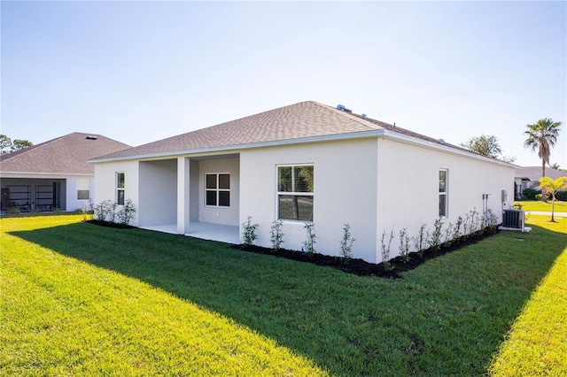 25372 Alicante Dr, Punta Gorda, FL 33955 - rear view of house featuring a patio, stucco siding, and a lawn