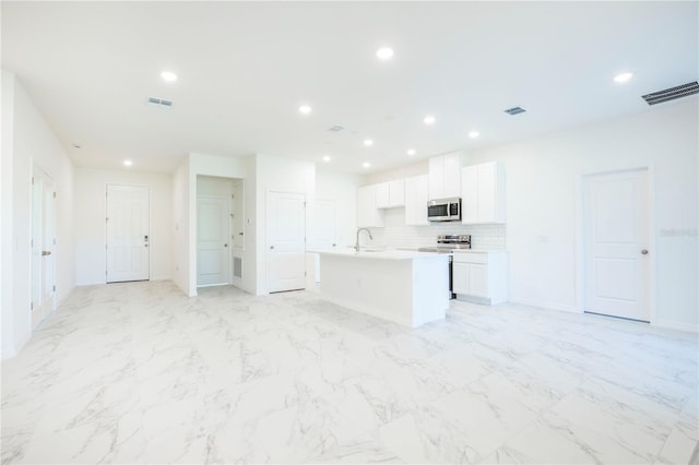 25372 Alicante Dr, Punta Gorda, FL 33955 - kitchen with visible vents, recessed lighting, and stainless steel appliances