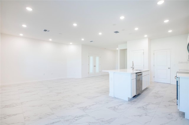 25372 Alicante Dr, Punta Gorda, FL 33955 - kitchen featuring recessed lighting, a kitchen island with sink, visible vents, and light countertops