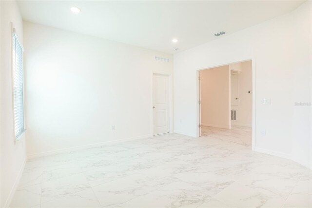 25372 Alicante Dr, Punta Gorda, FL 33955 - spare room with marble finish floor, baseboards, visible vents, and recessed lighting