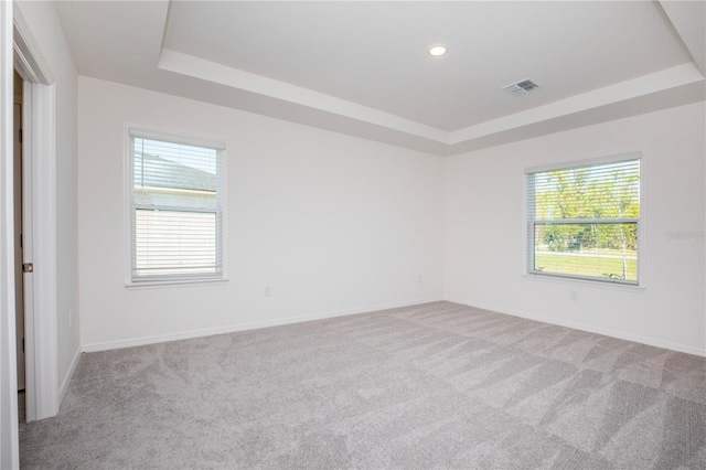 25372 Alicante Dr, Punta Gorda, FL 33955 - unfurnished room featuring light carpet, recessed lighting, a tray ceiling, and baseboards