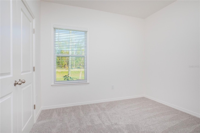 25372 Alicante Dr, Punta Gorda, FL 33955 - unfurnished room with baseboards, carpet flooring, and plenty of natural light
