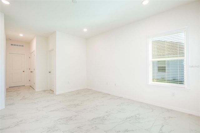 25372 Alicante Dr, Punta Gorda, FL 33955 - spare room featuring visible vents, recessed lighting, and marble finish floor