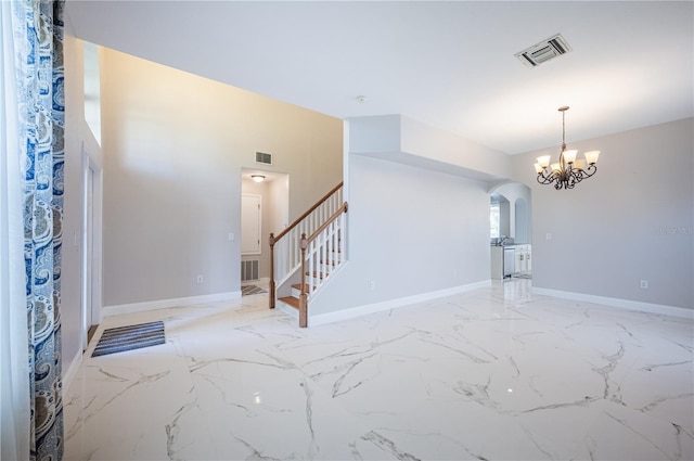31028 Baclan Dr, Wesley Chapel, FL 33545 - entryway with arched walkways, baseboards, stairway, and visible vents