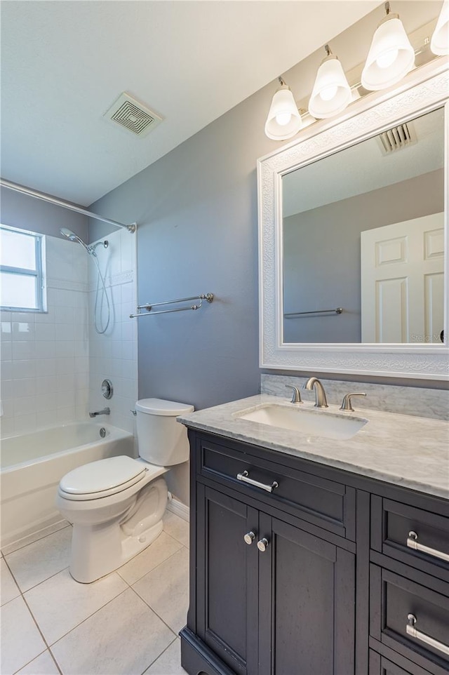 31028 Baclan Dr, Wesley Chapel, FL 33545 - bathroom with tile patterned floors, vanity, toilet, and visible vents