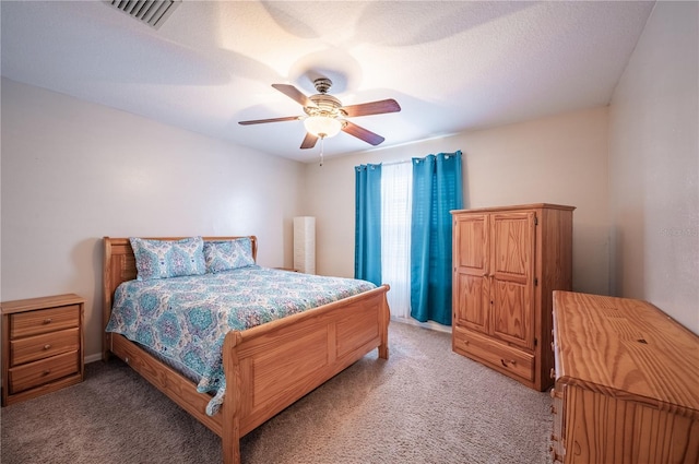 31028 Baclan Dr, Wesley Chapel, FL 33545 - bedroom featuring a textured ceiling, ceiling fan, visible vents, and light carpet