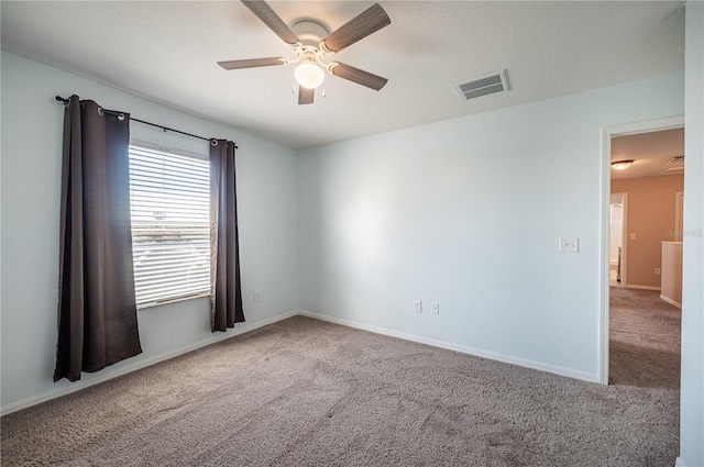31028 Baclan Dr, Wesley Chapel, FL 33545 - carpeted spare room featuring baseboards, visible vents, and a ceiling fan