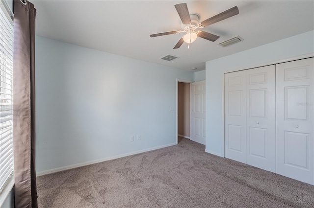 31028 Baclan Dr, Wesley Chapel, FL 33545 - unfurnished bedroom with carpet flooring, baseboards, a closet, and visible vents