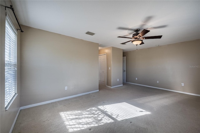 31028 Baclan Dr, Wesley Chapel, FL 33545 - carpeted spare room with baseboards, visible vents, and a ceiling fan