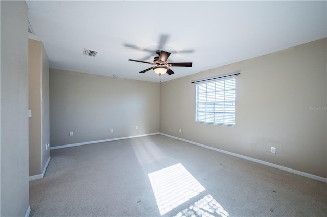 31028 Baclan Dr, Wesley Chapel, FL 33545 - spare room featuring baseboards, ceiling fan, visible vents, and light colored carpet