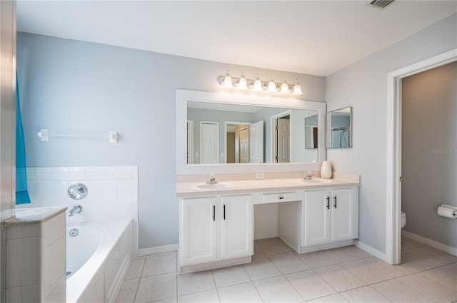 31028 Baclan Dr, Wesley Chapel, FL 33545 - full bathroom featuring a bath, toilet, tile patterned flooring, and a sink