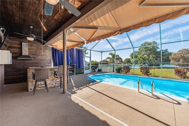 31028 Baclan Dr, Wesley Chapel, FL 33545 - pool featuring a patio, ceiling fan, and a lanai