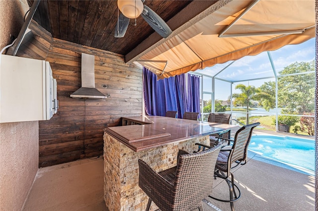 31028 Baclan Dr, Wesley Chapel, FL 33545 - view of patio / terrace with a ceiling fan, outdoor dry bar, a lanai, and an outdoor pool