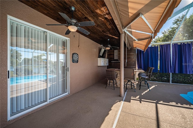 31028 Baclan Dr, Wesley Chapel, FL 33545 - view of patio featuring ceiling fan, outdoor dining space, and fence