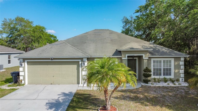 556 Hummingbird Ct, Kissimmee, FL 34759 - single story home featuring a garage, concrete driveway, stucco siding, and a shingled roof