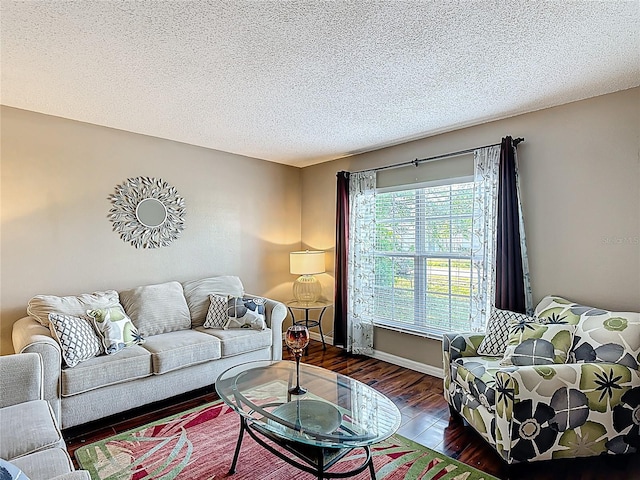 556 Hummingbird Ct, Kissimmee, FL 34759 - living area featuring baseboards, a textured ceiling, and wood finished floors