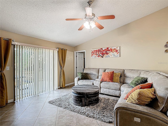 556 Hummingbird Ct, Kissimmee, FL 34759 - living area with a textured ceiling, baseboards, tile patterned floors, a ceiling fan, and vaulted ceiling