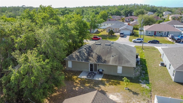 556 Hummingbird Ct, Kissimmee, FL 34759 - birds eye view of property with a residential view and a forest view
