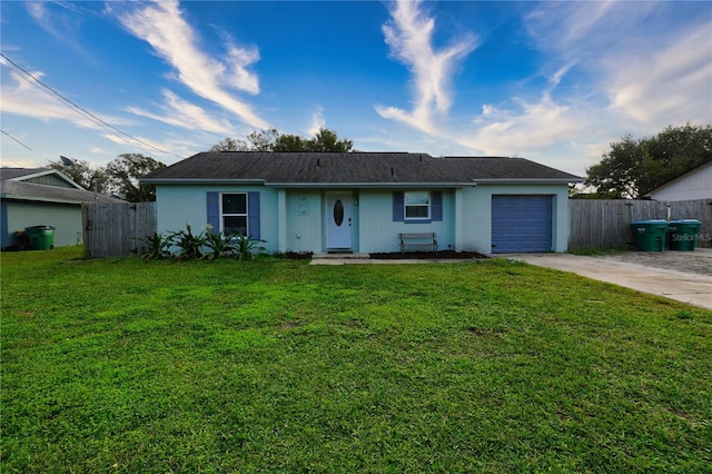 1491 Lavender St, Deltona, FL 32725 - ranch-style home featuring a front yard, driveway, fence, and an attached garage