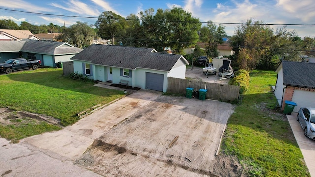 1491 Lavender St, Deltona, FL 32725 - view of front of home with concrete driveway, stucco siding, fence, an attached garage, and a front lawn