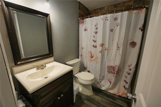 1491 Lavender St, Deltona, FL 32725 - full bathroom with wood finished floors, toilet, vanity, a shower with curtain, and a textured wall