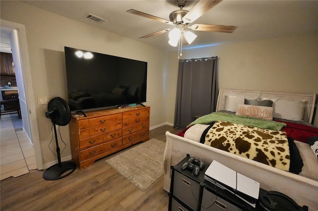 1491 Lavender St, Deltona, FL 32725 - bedroom with a ceiling fan, wood finished floors, baseboards, and visible vents