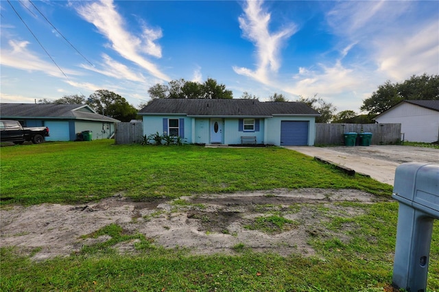 1491 Lavender St, Deltona, FL 32725 - ranch-style house featuring driveway, a front lawn, fence, and an attached garage