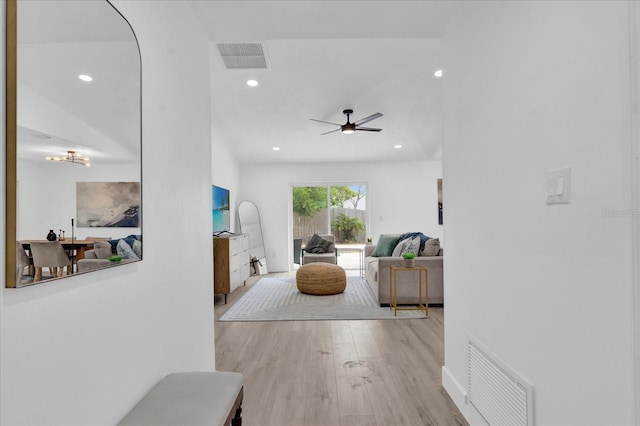 living area with visible vents, recessed lighting, a ceiling fan, and wood finished floors