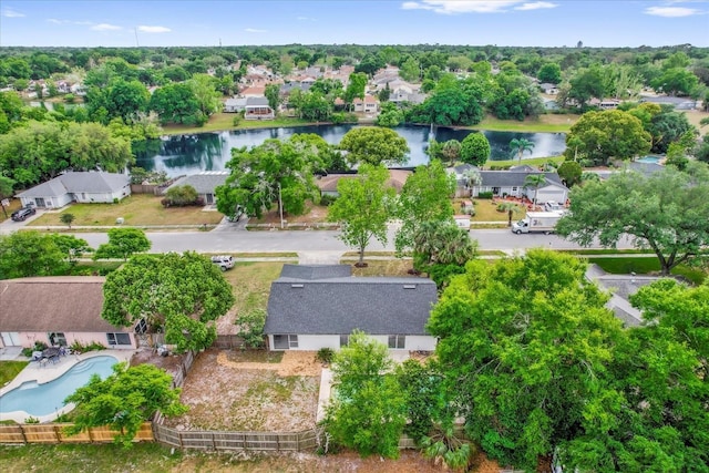 drone / aerial view with a water view and a residential view