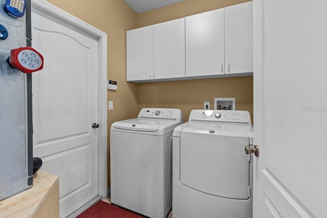 2721 Village Pine Ter, Orlando, FL 32833 - laundry area with washer and clothes dryer and cabinet space