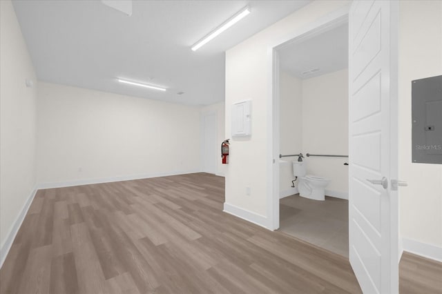 927 City Walk Ln, Oviedo, FL 32765 - spare room featuring wood finished floors, baseboards, and electric panel