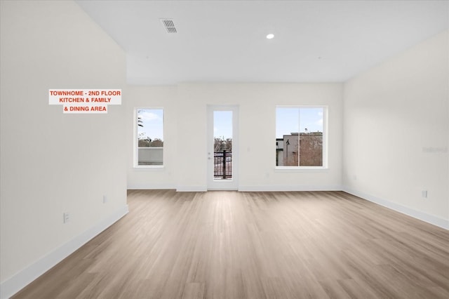 927 City Walk Ln, Oviedo, FL 32765 - unfurnished room featuring light wood-style flooring, visible vents, and a healthy amount of sunlight