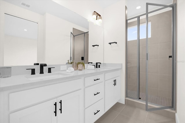 927 City Walk Ln, Oviedo, FL 32765 - bathroom featuring a shower stall, tile patterned floors, a sink, visible vents, and double vanity