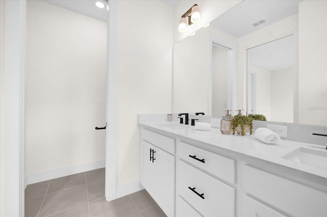927 City Walk Ln, Oviedo, FL 32765 - full bathroom featuring baseboards, double vanity, a sink, and tile patterned floors