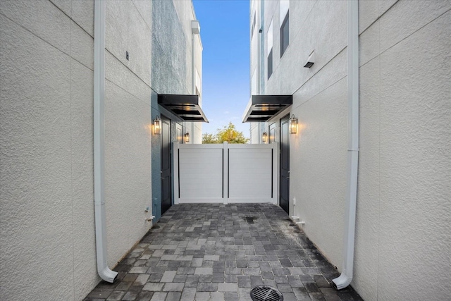 927 City Walk Ln, Oviedo, FL 32765 - view of side of property featuring stucco siding, a gate, and fence