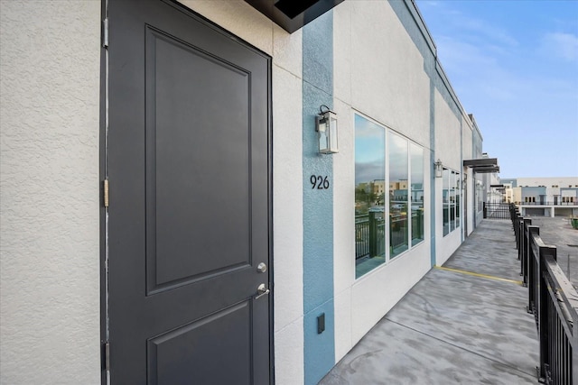 927 City Walk Ln, Oviedo, FL 32765 - view of exterior entry featuring a balcony and stucco siding