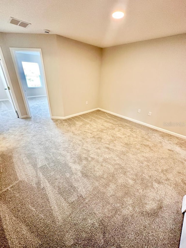2834 Narcoossee Commons Way, Saint Cloud, FL 34771 - unfurnished room with carpet floors, baseboards, and a textured ceiling
