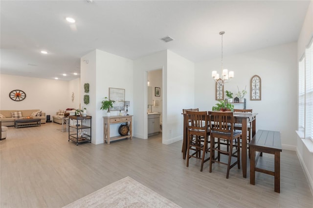 dining room with light wood-type flooring, recessed lighting, baseboards, a chandelier, and visible vents