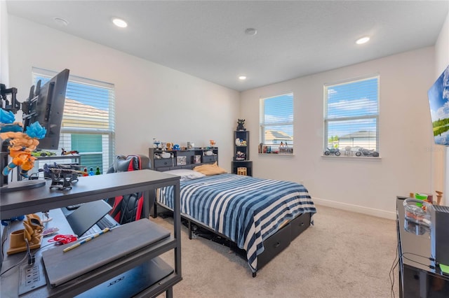 carpeted bedroom featuring baseboards, recessed lighting, and multiple windows