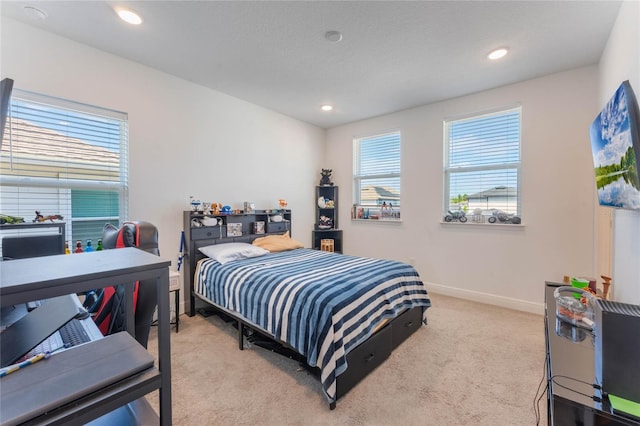 bedroom with baseboards, recessed lighting, and light colored carpet