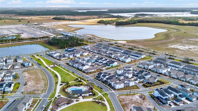 bird's eye view with a residential view and a water view
