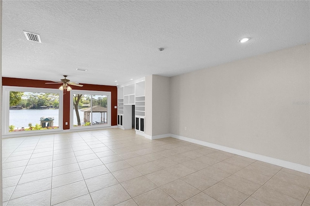 7706 Waunatta Ct, Winter Park, FL 32792 - unfurnished living room with a ceiling fan, a water view, baseboards, and visible vents