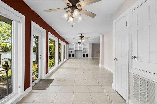 7706 Waunatta Ct, Winter Park, FL 32792 - corridor with baseboards, visible vents, and light tile patterned floors