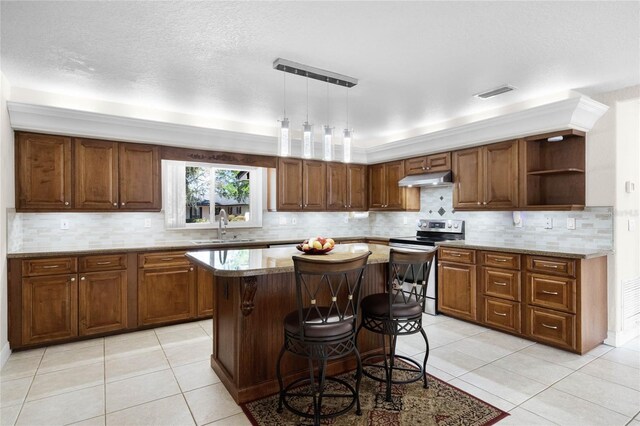 7706 Waunatta Ct, Winter Park, FL 32792 - kitchen with stainless steel electric range, under cabinet range hood, a sink, open shelves, and a center island