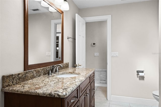 7706 Waunatta Ct, Winter Park, FL 32792 - bathroom featuring visible vents, baseboards, toilet, vanity, and tile patterned flooring