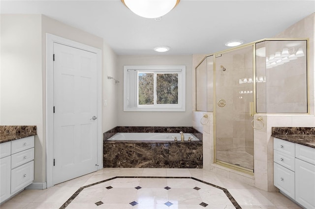 7706 Waunatta Ct, Winter Park, FL 32792 - full bathroom with vanity, a stall shower, and a garden tub