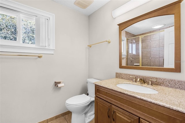 7706 Waunatta Ct, Winter Park, FL 32792 - full bath featuring a stall shower, toilet, vanity, tile patterned flooring, and baseboards