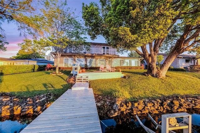 7706 Waunatta Ct, Winter Park, FL 32792 - back of property with a balcony, a patio, and a yard
